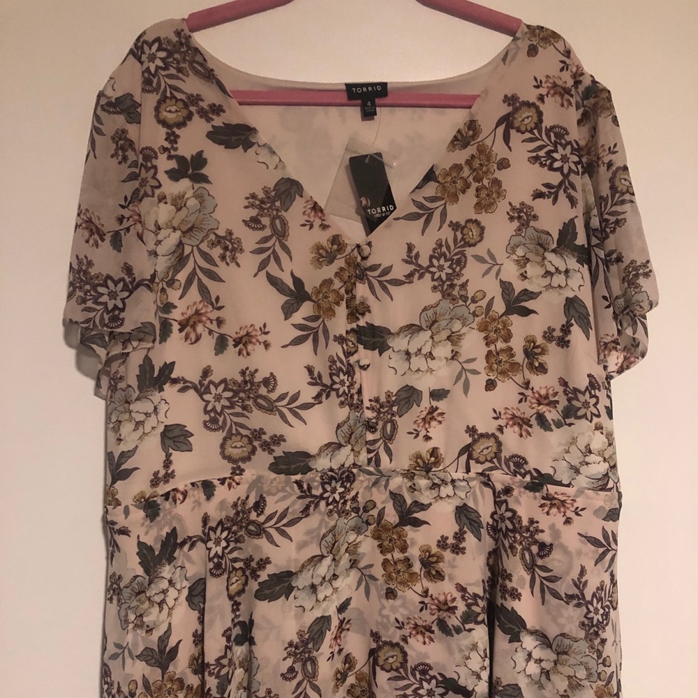 Ruffled floral peplum top with sheer sleeves